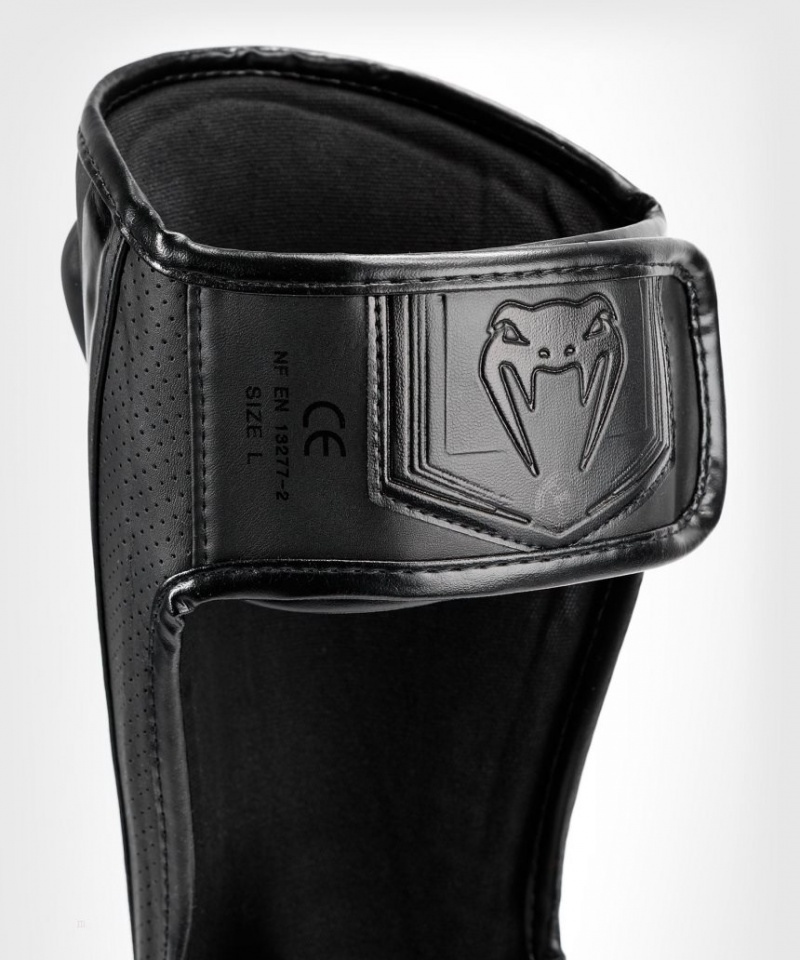 Protège Tibia Venum Elite Evo Noir  | JVI-3870937